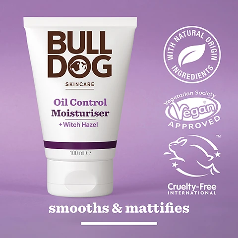 Image 2 - A brand of skincare moisturizer by Bulldog is displayed in a white tube with a purple background, labeled Oil Control Moisturiser + Witch Hazel, featuring icons for natural ingredients, vegan approval, and cruelty-free certification, with the text smooths & mattifies at the bottom.
Image 3 - A close-up image of yellow witch hazel flowers with visible text stating 95% Natural Origin, Unlock the true potential of natural origin ingredients, and Witch Hazel.
Image 4 - A person holds a tube of Bulldog skincare oil control moisturizer in one hand, with the cap off and resting in the other hand, and the text For Oily Skin is visible at the bottom.
Image 5 - A tube of Bulldog Skincare Oil Control Moisturiser with Witch Hazel sits on a bathroom countertop, featuring text that states it is made from over 27% sugarcane and over 62% PCR plastic along with the label Recycled Tube.
Image 6 - Three Bulldog Skincare tubes are displayed on a bathroom countertop, labeled as Oil Control Face Wash, Oil Control Face Scrub, and Oil Control Moisturiser, along with the text Mattify & Balance Oil Prone Skin.