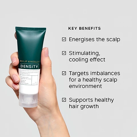 Image 1 - A hand holds a green and white tube of Philip Kingsley Density Stimulating Scalp Mask Masque Stimulant Pour Cuir Chevelu, with text that reads Energises and balances the scalp Stimule et équilibre le cuir chevelu 75ml, and to the right is a list of Key Benefits: Energises the scalp, Stimulating, cooling effect, Targets imbalances for a healthy scalp environment, Supports healthy hair growth. Image 2 - A cream-colored background displays a list of product ingredients with checkmarks next to each, reading: KEY INGREDIENTS SYNERGISTIC BOTANICAL BLEND Three botanical actives work to help slow hair loss. PIROCTONE OLAMINE Antimicrobial. ZINC PCA Boasts antibacterial and antifungal properties. CAFFEINE Known to help stimulate the scalp. Image 3 - A person with reddish-brown hair has a white scalp treatment applied along their hair part, with visible text that reads: TRICHOLOGIST TIP Scalp masks help exfoliate and remove dead skin cells. Acting as both a scalp scrub and cleanser, they are effective in preventing product build-up and oiliness. Image 4 - A hand applies Philip Kingsley Density Stimulating Scalp Mask from a dark green and white tube to a scalp with brown hair, next to instructions for use, with visible text reading: PHILIP KINGSLEY DENSITY STIMULATING SCALP MASK MASQUE STIMULANT POUR CUIR CHEVELU energises and balances the scalp stimule et equilibre le cuir chevelu 75ml 2.53 fl oz HOW TO USE 1. Dampen hair and apply directly to the scalp from the tube in partings approximately 3cm (1) apart. 2. Gently massage over the scalp. A cooling, tingling sensation can be expected. 3. Leave for 10-20 minutes, rinse well, then follow with shampoo and conditioner. Repeat weekly. Image 5 - A white and dark green tube of Philip Kingsley Density Stimulating Scalp Mask with a dollop of white cream squeezed out below it, accompanied by text 91% reported their scalp felt NOURISHED*, 91% reported a POSITIVE EFFECT on the health and condition of their scalp*, 86% reported roots looked HEALTHY*, *INDEPENDENT USER TRIALS, PHILIP KINGSLEY DENSITY STIMULATING SCALP MASK MASQUE STIMULANT POUR CUIR CHEVELU, Energises and balances the scalp Stimule et equilibre le cuir chevelu, 75ml e 2.53 fl oz. Image 6 - A hand applies a white scalp mask from a tube with a narrow nozzle directly to the roots of brown hair on a scalp, accompanied by the text Effortless to apply, my scalp and roots look and feel so REFRESHED and HEALTHY already. BLIND USER PANEL COMMENT, and on the product tube, Philip Kingsley Density Stimulating Scalp Mask Masque Stimulant Pour Cuir Chevelu 75ml 2.53 fl oz.