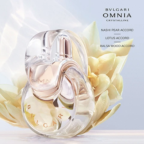 Image 3 - A clear, sculptural BVLGARI OMNIA Crystalline perfume bottle, inscribed with BVLGARI on its base and OMNIA on its inner part, is set amidst delicate pale yellow flower petals dotted with water, against a soft gradient background, with additional text listing BVLGARI OMNIA CRYSTALLINE, NASHI PEAR ACCORD, LOTUS ACCORD, BALSA WOOD ACCORD. Image 6 - Two clear, oval-shaped Bvlgari Omnia Crystalline perfume bottles, one lighter for Eau de Toilette and one amber-toned for Eau de Parfum, are displayed against a soft background featuring a creamy lotus petal, a gnarled piece of driftwood, and a slice of fruit, with visible text Bvlgari Omnia Crystalline, Eau de Toilette, Radiant Crispy, Eau de Parfum, Graceful Enveloping, Bvlgari, and Omnia. Image 7 - The image shows four Bvlgari Omnia perfume bottles, each with a different color and floral background: a red bottle against hibiscus, a clear bottle against lotus, a gold bottle against jasmine, and a purple bottle against irises; the visible text lists BVLGARI OMNIA CORAL EAU DE TOILETTE FLORAL FRUITY JUICY LIVELY, BVLGARI OMNIA CRYSTALLINE EAU DE TOILETTE FLORAL WOODY RADIANT CRISPY, BVLGARI OMNIA CRYSTALLINE EAU DE PARFUM FLORAL WOODY GRACEFUL ENVELOPING, BVLGARI OMNIA AMETHYSTE EAU DE TOILETTE FLORAL FLORAL DELICATE POWDERY.