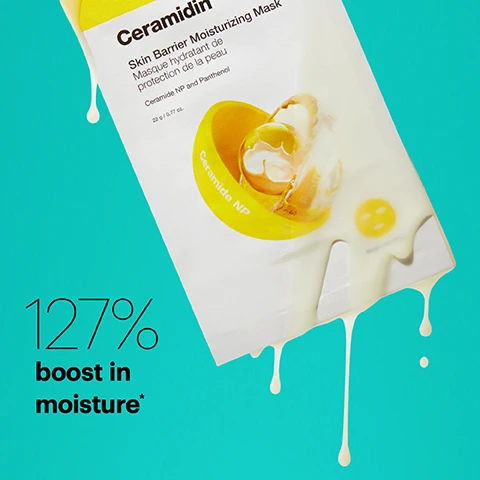 Image 1 - A skincare product packaging for Ceramidin Skin Barrier Moisturizing Mask is shown against a bright turquoise background, with a depiction of a yellow droplet and the text 127% boost in moisture*.
Image 2 - A close-up of a yellow facial mask with a minimalist face design, featuring the text that reads: Formulated with Ceramide NP for barrier strength and Panthenol for moisture.
