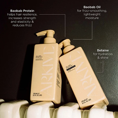 Image 5 - Two cream-colored ARKIVE hair product bottles, a shampoo and a conditioner, stand on a white ridged surface against a dark background, with visible text including Baobab Protein helps hair resilience, increases strength and elasticity & reduces frizz, Baobab Oil for frizz-smoothing, lightweight moisture, Betaine for hydration & shine, and bottle labels ALL DAY EVERYDAY SHAMPOO SHAMPOOING ARKIVE BY ADAM REED 250 mL e 8.5 FL. OZ. (US) and ALL DAY EVERYDAY CONDITIONER APRÈS SHAMPOOING ARKIVE BY ADAM REED 250 mL e 8.5 FL. OZ. (US). Image 6 - A hand holds a light peach pump bottle labeled Arkive All Day Everyday Conditioner, next to text instructions reading HOW TO USE: After shampooing with the All Day Everyday shampoo, dispense a grape-sized amount of conditioner and work between hands. Apply from mid-lengths to ends, then up to roots. Allow to sit for 2 minutes and then rinse thoroughly. TOP TIPS: Comb through hair to detangle before beginning cleansing routine. Don’t skimp the rinse - rinsing thoroughly is a key step in keeping your scalp balanced and healthy. The bottle also shows APRÈS SHAMPOOING, BY ADAM REED, 250 ml e, and 8.5 fl. oz. Image 7 - A close-up image features a reddish fruit, green leaves, and white flowers, accompanied by text that reads: SMELLS LIKE: FUTURE BLOOM A genderful floral fragrance that emulates a sun-soaked summer walk: liberating, luminous and full of potential. HEAD NOTES MANDARIN RHUBARB HEART NOTES JASMINE LILY OF THE VALLEY GROUND NOTES TEA ROSE VANILLA. Image 8 - Two light beige pump bottles, one shampoo and one conditioner, are nestled amongst green leaves, orange slices, vanilla beans, and pink petals, displaying text that reads Made without: Aluminium, Ammonia, Lactose, Latex, Mineral Oil, Parabens, Silicone, Sulphate, Gluten, Talc; each bottle labeled All Day Everyday Shampoo Shampooing or All Day Everyday Conditioner Après Shampooing, 250 mL e 8.5 FL. OZ. (US); and additional text to the right indicates Vegan, Certified B Corporation, Made with Recycled Content, Cruelty Free International, and Award Winning.