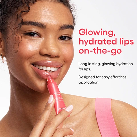 Image 1 - A smiling woman with glowing skin applies clear lip balm from a pink LANEIGE tube, labeled GLOWY BALM BAUME BRILLANT POUR LES LÈVRES BERRY FRUITS ROUGES 0.35 oz. / 10 g, to her hydrated lips, while text on the right proclaims Glowing, hydrated lips on-the-go, Long lasting, glowing hydration for lips, and Designed for easy effortless application. Image 2 - A pink Laneige Lip Glowy Balm in Berry flavor stands among fresh raspberries, blackberries, and strawberries with pink lip gloss smears, accompanied by text that reads Lips as smooth as butter, Infused with two blends of butter for the smoothness your lips crave, Shea Butter to nourish, Murumuru Seed Butter to hydrate, LANEIGE, LIP GLOWY BALM, BAUME BRILLANT POUR LES LÈVRES, BERRY, FRUITS ROUGES, Net Wt. 0.35 oz. / Poids net 10 g. Image 3 - The image shows a large, ripe red strawberry with green leaves on a white background, above which is text reading BUTTER UP, THEN PUCKER UP! After 1 Week of Use, with four statistics in pink circles: 98% Agreed lips look glossy & feel smoother, 96% Agreed lips feel nourished, 94% Agreed lips feel well-hydrated, and 92% Agreed lips look less flaky. Image 4 - A cluster of seven colorful lip gloss bottles in shades of purple, yellow, pink, and red, with a small dollop of gloss visible on each dispenser top, accompanies the text Glossing 10 million* lips worldwide! *Period: 2017 - 2023.