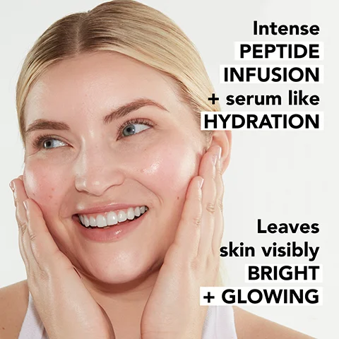Image 1 - A smiling person with light skin is holding their face with both hands, showcasing healthy skin, with the visible text reading Intense PEPTIDE INFUSION + serum like HYDRATION Leaves skin visibly BRIGHT + GLOWING.