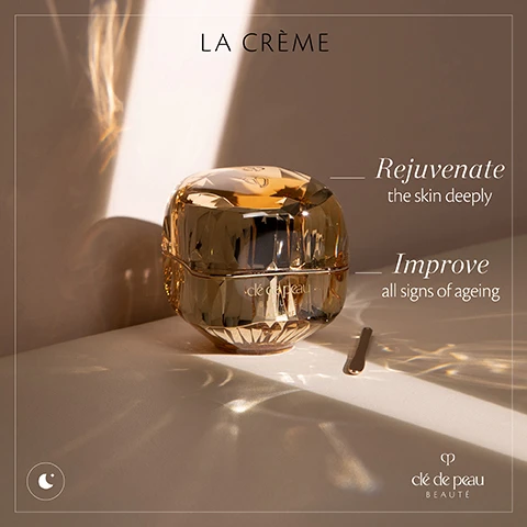 Image 1 - A luxurious gold jar of cream labeled LA CRÈME is placed on a light surface with a small spatula beside it, surrounded by gentle reflections of light, and features the text Rejuvenate the skin deeply and Improve all signs of ageing next to the jar, along with the brand name clé de peau BEAUTÉ.
Image 2 - A luxurious, crystal-like jar of anti-aging night cream is centered in the image, with the product name La Crème and a tagline The ultimate anti-ageing night cream displayed above, alongside percentages stating 100% felt their skin looked smoother and 98% felt their skin looked healthy, along with additional product information at the bottom.