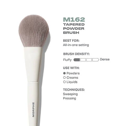 Image 3 - Image of a tapered powder brush with a fluffy bristle head resting against a white background, accompanied by product information that reads M162 TAPERED POWDER BRUSH, BEST FOR: All-in-one setting, BRUSH DENSITY: Fluffy, USE WITH: Powders, Creams, Liquids, TECHNIQUES: Sweeping, Pressing.
Image 4 - Image shows a tapered powder brush from Morphe, with a plush brush head visible from the top and side views; the dimensions indicated are 49mm for the brush head and 199mm for the overall length, along with the text M162 Tapered Powder Brush.
Image 5 - A close-up of a makeup brush with soft bristles, alongside text that reads best-in-brush benefits, bristles infused with silver ion technology, known to have antibacterial benefits, engineered to hold up to your daily routine, designed with pro-perfect brush heads.
Image 6 - Image shows four different types of powder brushes with white handles and soft bristles; each brush is labeled with its type and has corresponding text: M161 Large Rounded Powder Brush, M162 Tapered Powder Brush, M163 Paddle Powder Brush, M164 Small Pointed Powder Brush, and the header reads FIND YOUR POWDER BRUSH.
Image 7 - An instructional infographic on brush care featuring five steps: 1) Wet bristles with warm water and a gentle cleanser. 2) Swirl bristles on the palm of your hand. 3) Rinse and repeat until water appears clear. 4) Gently squeeze out any excess moisture. 5) Reshape the bristles, then place the brush flat or upside down to air-dry. The bottom includes a caution about avoiding hot water and submerging the brush.