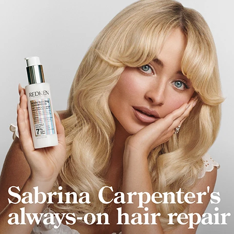 Image 1 - A woman with long blonde hair is holding a bottle labeled REDKEN acidic bonding concentrate while resting her chin on her hand, with text below stating Sabrina Carpenters always-on hair repair.
Image 2 - A bottle of Redken Acidic Bonding Concentrate shampoo is shown with bubbles and a shiny background, featuring text that reads 56% LESS BREAKAGE*, SILKY FINISH & GLOSSY SHINE, and 11X SMOOTHER**.
Image 3 - A bottle of Redken 24/7 Bond Repair Overnight Treatment is positioned in the center with text stating 24/7 BOND REPAIR OVERNIGHT TREATMENT, UP TO 89% LESS BREAKAGE*, and UP TO 3X SOFTER*, alongside the product details and specifications.
Image 4 - Image shows a side-by-side comparison of hair labeled BEFORE on the left with wavy, frizzy texture, and AFTER ONE USE* on the right with sleek, straight, and shiny hair; additional text at the bottom reads *SYSTEM OF ACIDIC BONDING CONCENTRATE INTENSIVE TREATMENT, SHAMPOO, CONDITIONER, & LEAVE-IN VS. UNDAMAGED HAIR.
Image 5 - A side-by-side comparison image showing a woman with curly brown hair before and after using a hair product, with visible text saying BEFORE on the left and AFTER on the right, along with a note on the bottom regarding the products used.
Image 6 - Image shows a smooth, white, creamy substance with a bubbly texture on one side, accompanied by bold text stating: CITRIC ACID + BONDING CARE COMPLEX HELPS REPAIR BONDS + PREVENT FUTURE DAMAGE.
Image 7 - A modern graphic featuring the text CITRIC ACID PENETRATES 7 LAYERS DEEP & STRENGTHENS HAIR* on a light gray background, accompanied by a wireframe geometric illustration, with additional text at the bottom stating *CONTINUED USE OF SYSTEM OF ABC SHAMPOO, CONDITIONER, AND SERUM VS. UNTREATED HAIR.
Image 8 - A person wearing a black shirt holds a bottle of Redken acidic bond concentration in one hand while the other hand displays a small amount of cream, with text that reads START WITH 2 PUMPS, ADD MORE AS NEEDED REAPPLY NIGHT AND DAY AS DESIRED.
Image 9 - Two images side by side showing a person with curly hair applying a product to their hair, with visible text saying APPLY TO MID-LENGTHS & ENDS ON DAMP OR DRY HAIR.
Image 10 - Image shows two bottles of Redken acidic bonding concentrate shampoo and conditioner against a gradient background, with the text BEST IVE EVER USED AND IM A HAIRDRESSER and a star rating above, followed by *RECEIVED THE PRODUCT TO TRY FROM MARIE CLAIRE BEAUTY DRAWER, AUG 2022.
Image 11 - Image shows three hair care products from Redken labeled as part of a strength repair routine, including shampoo, conditioner, and an overnight leave-in serum, with visible text detailing their names and descriptions.