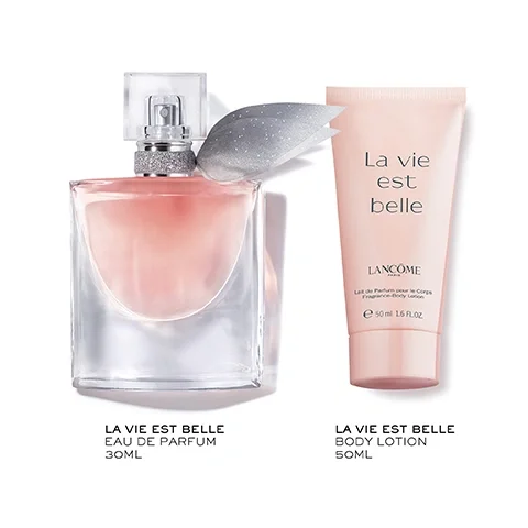 Image 1 - Image shows a glass bottle of La Vie Est Belle Eau de Parfum (30ml) with a silver ribbon on top, next to a pink tube of La Vie Est Belle Body Lotion (50ml) with visible text reading La Vie Est Belle and Lancôme Paris.