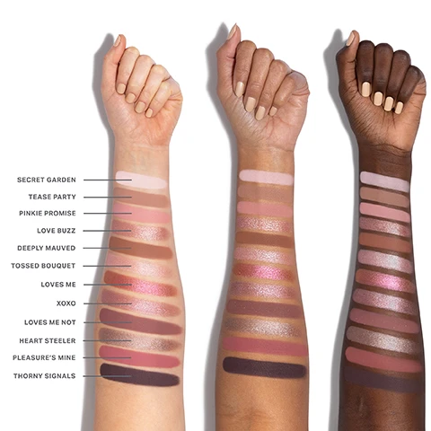 Image 1 - Three arms of different skin tones are shown with various makeup swatches displayed in rows, labeled with names like Secret Garden, Tease Party, Pinkie Promise, and more, alongside corresponding shades.
Image 2 - A collection of twelve shades of pressed eyeshadow arranged in a grid, each shade is labeled with a number and a name; colors include soft pinks, rich browns, and shimmery tones.
Image 3 - Close-up of a persons eye with brown and pink eyeshadow, thick eyelashes, and a light brown eyebrow, with swatches of pink shades labeled 01, 03, and 11 in the lower left corner.
Image 4 - A close-up of a womans eye showcasing a soft, shimmery eyeshadow in shades of pink and brown, with a color palette below displaying swatches labeled 01, 02, 06, 08, and 12.
Image 5 - Image features a textured background with swatches of eyeshadow in various shades, including a deep brown and a shimmering pink, alongside text that highlights features of the Chromaplus blend, including pigment-packed performance, all-day wear, and luxurious blendability. The visible text states: THE POWER OF CHROMAPLUS BLEND, PIGMENT-PACKED PERFORMANCE High-impact color in a single swipe.*, ALL-DAY, CREASEPROOF WEAR Vibrancy that stays put—no creasing or fading.*, LUXURIOUS BLENDABILITY & BUILDABILITY Nonpatchy, seamless application and a silky-smooth feel.*
Image 6 - A display of three open makeup palettes with various eyeshadow colors, surrounded by text that highlights features such as Next-Gen Formats, Endless Expression, and Ready When You Are.
Image 7 - Image shows three sections of differently textured powders with labels; the first section labeled SEAMLESS MATTES describes a light pink matte texture, the second labeled LUMINOUS SHIMMERS showcases a shimmery pink texture, and the third labeled HIGH-SHINE METALLICS features a glittery pink metallic texture, all under the heading EXPRESSIVE FINISHES. EFFORTLESS DIMENSION.
