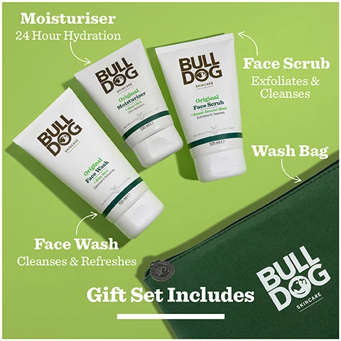 Image 1 - A Bulldog Skincare gift set with three product tubes and a wash bag featuring the text Moisturiser 24 Hour Hydration BULL DOG SKINCARE Original Moisturiser + Aloe Vera 24 Hour Hydration 100 ml e BULL DOG SKINCARE Original Face Wash + Aloe Vera Cleanse & Refreshes 150 ml e BULL DOG SKINCARE Original Face Scrub + Sweet Almond Shell Exfoliates & Cleanses 125 ml e Face Scrub Exfoliates & Cleanses Wash Bag BULL DOG SKINCARE Face Wash Cleanse & Refreshes Gift Set Includes. Image 2 - A hand squeezes a tube of Bulldog Skincare Original Moisturiser onto another hand, the tube is labeled Bulldog Skincare Original Moisturiser + Aloe Vera 24hr Hydration 96% Natural Origin Recycled 100 ml e, and the image also contains the text Normal To Dry Skin. Image 3 - Close-up of a green aloe vera leaf with text overlay that reads Natural Origin Ingredients, To refresh your daily routine, Cleanses & Hydrates. Image 4 - A dark green pouch with three white tubes of Bulldog skincare products, Original Face Wash, Original Moisturiser, Original Face Scrub, displayed on a green sleeve marked Original Skincare Kit, with additional logos stating With Natural Origin Ingredients, Vegetarian Society Vegan Approved, and Cruelty-Free INTERNATIONAL. Image 5 - A Bulldog Skincare Original Skincare Kit box sits with a green pouch and contains three tubes, featuring text BULLDOG SKINCARE Original Skincare Kit Cleanses & Hydrates Your Skin and below the kit is the text #ProtestPointlessGifts.