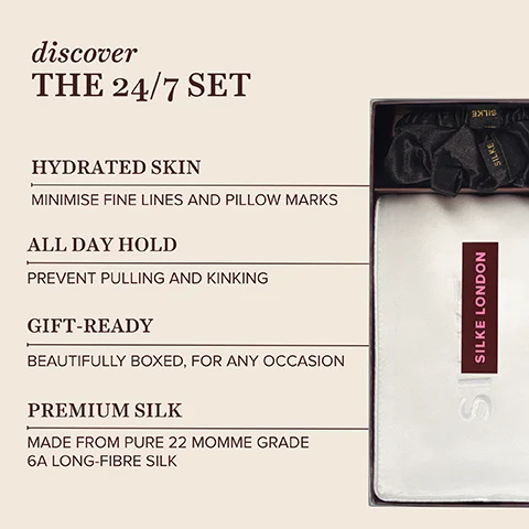 A product image showing a partially open dark box on the right, containing black silk scrunchies with the word SILKE and a white folded silk pillowcase with a vertical SILKE LONDON label, alongside text on the left that reads discover THE 24/7 SET, HYDRATED SKIN MINIMISE FINE LINES AND PILLOW MARKS, ALL DAY HOLD PREVENT PULLING AND KINKING, GIFT-READY BEAUTIFULLY BOXED FOR ANY OCCASION, PREMIUM SILK MADE FROM PURE 22 MOMME GRADE 6A LONG-FIBRE SILK.