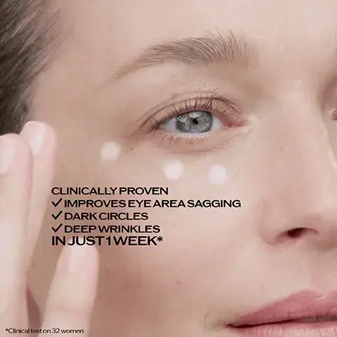 Image 2 - A close-up image shows a persons hand applying white dots of product around their right eye, with the text Clinically proven, Improves eye area sagging, Dark circles, Deep wrinkles, In just 1 week*, and *Clinical test on 32 women. Image 3 - A promotional image features a before and after comparison of a womans eye, showing noticeable wrinkles under the eye in the before image and smoother skin in the after image, next to a gold and purple jar of Shiseido Vital Perfection Uplifting and Firming Advanced Eye Cream with a blue applicator, with text reading: BEFORE, AFTER**, **Results based on a self-evaluation by @fionabrackenbury after 8 weeks with x2 applications per day, everyday (Non-retouched photo), NEW VITAL PERFECTION Uplifting and Firming Advanced Eye Cream, Clinically proven to improve eye area sagging, dark circles & deep wrinkles in just 1 week*, *Clinical test on 32 women, and on the product jar: SHISEIDO VITAL PERFECTION Uplifting and Firming Advanced Eye Cream Crème Yeux Lift Fermeté.Image 4 - The image displays a three-step guide for a Japanese 3-in-1 eye massager tool, showing Step 1 with a blue spatula scooping cream from a jar, Step 2 with a massage roller used on a closed eye, and Step 3 with a turbo point massager used near an open eye, accompanied by text: NEW JAPANESE 3IN1 EYE MASSAGER TOOL Clinically proven to amplify the eye cream effect UNDER EYE IS +113% BRIGHTER* *vs the cream alone, instrumental test on 32 volunteers in 1 week. Image 5 - A Shiseido Vital Perfection eye cream jar with a blue applicator sits in front of a glass tube filled with yellow liquid and orange-red safflower petals, with additional safflower flowers on the sides, displaying the text Retinol ACE, Helps to promote epidermal hyaluronic acid production*, SafflowerRED™, WITH SAFFLOWER GROWN IN JAPAN, Helps to boost skins self-regeneration*, SHISEIDO VITAL PERFECTION Uplifting and Firming Advanced Eye Cream Crème Yeux Lift Fermeté, and *In vitro. Image 6 - A Shiseido Vital Perfection eye cream jar with a gold top and purple base, and a dark blue applicator, sits in front of a large, sparkling golden orb on a white background, with text that reads Retinol+ SafflowerRED™ 3 TIMES MORE EFFECTIVE THAN RETINOL ALONE* SHISEIDO VITAL PERFECTION Uplifting and Firming Advanced Eye Cream Crème Yeux Lift Fermeté *Clinical test on 40 women. In 1 week on crows feet and underneath eye wrinkles. Image 8 - A woman with long dark hair, Anne Hathaway, looks directly at the camera while holding a gold and purple jar of eye cream, with the brand and product text SHISEIDO VITAL PERFECTION Lifting and Firming Advanced Eye Cream Crème Yeux Lift Fermeté visible on the jar and the brand name SHISEIDO GINZA TOKYO along with a floral logo displayed at the bottom of the Image 10 - The image compares two Shiseido Vital Perfection eye creams, an older tall pump bottle on the left and a new shorter jar with a blue massage roller on the right, with text that reads NEW FORMULA&PACK, SAME PRODUCT, Vital Perfection Uplifting and Firming Eye Cream VS NEW Vital Perfection Uplifting and Firming Advanced Eye Cream; the left bottle label says SHISEIDO Vital Perfection Uplifting and Firming Eye Cream Crème Yeux Lift Fermeté, and the right jar label says SHISEIDO Vital Perfection Uplifting and Firming Advanced Eye Cream Crème Yeux Lift Fermeté; additional text beneath states Now 3 TIMES MORE EFFECTIVE On eye wrinkles thanks to Retinol ACE & SafflowerRED™ combination*, NEW MASSAGE ROLLER Clinically proven to amplify the eye cream effects on multiple aging signs, and *Clinical test on 40 women. In 1 week on crows feet & underneath eye wrinkles. Image 11- A visual comparison shows a persons eye area before and after using an eye cream, with the after image displaying fewer wrinkles and smoother skin, along with a jar of Shiseido Vital Perfection eye cream and applicator, and includes the text: BEFORE AFTER** **Results based on a self-evaluation by @fionabrackenbury after 8 weeks with x2 applications per day, everyday (Non-retouched photo) NEW VITAL PERFECTION Uplifting and Firming Advanced Eye Cream Clinically proven to improve eye area sagging, dark circles & deep wrinkles in just 1 week* *Clinical test on 32 women SHISEIDO VITAL PERFECTION Uplifting and Firming Advanced Eye Cream Crème Yeux Lift Fermeté